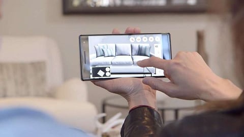 a hand holding a cell phone