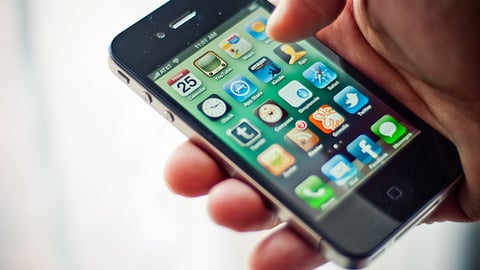 a hand holding a cellphone