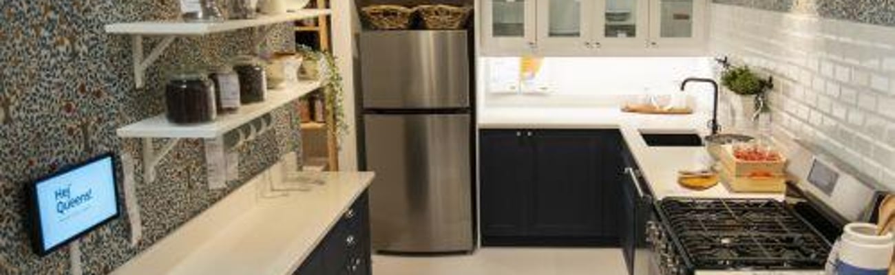 a kitchen with a stove a sink and a microwave